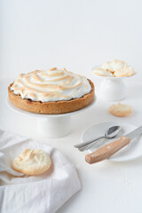 Sand cake with cherries. White background with dessert. Baking with meringue.