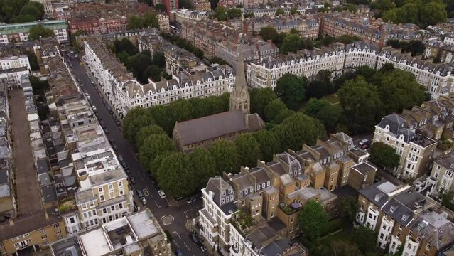 Drone view of St Luke's Earls Court armed with trees and buildings in London.