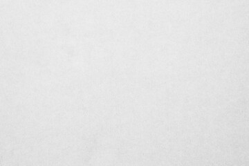 White recycled craft paper texture as background. Grey paper texture, Old vintage page or grunge vignette of old cardboard.	
