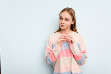 Young caucasian girl isolated on blue background making up plan in mind, setting up an idea.