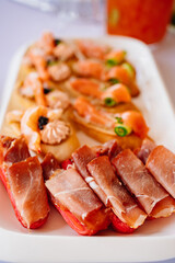 Selective focus. dried meat and tartlets with pate and seafood. 