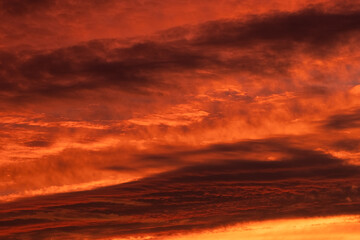 Orange and red sky at sunset and dawn. structure and texture of clouds. different shapes and types of sky. Photo and wallpaper on the desktop. beautiful transfusion of colors and smooth transition.