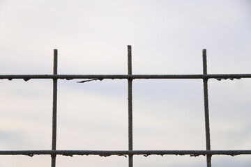 barbed wire fence with sky