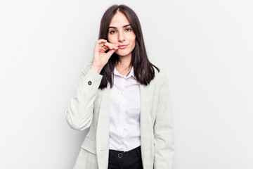 Fototapeta premium Young business caucasian woman isolated on white background with fingers on lips keeping a secret.