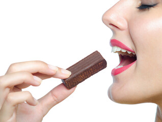 Portrait of the beautiful girl eating chocolate cookies