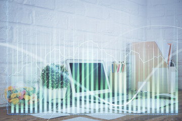Forex market chart hologram and personal computer background. Multi exposure. Concept of investment.