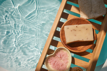 Fototapeta na wymiar Spa decoration, relaxation preparation, natural organic products on a bathtube.