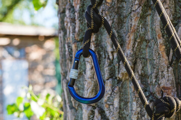 carbine with clutch. Equipment for climbing and mountaineering. Safety rope