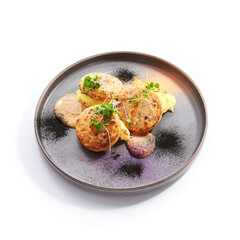 Fishcakes with garden cress side view