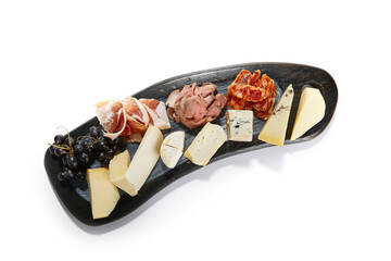 Cheese plate with meat and grapes