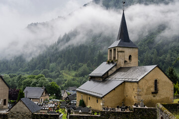 Fototapeta na wymiar Saint-Jacques Romanesque church from the 12th century, Oô town, Occitanie, canton of Bagnères-de-Luchon, Pyrenean mountain range, France