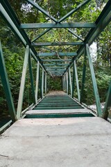 old metal bridge in country forest Thailand