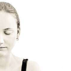 Young adult woman with beautiful face, clean healthy skin - isolated on white. Skin care concept. Closed eyes. Sepia