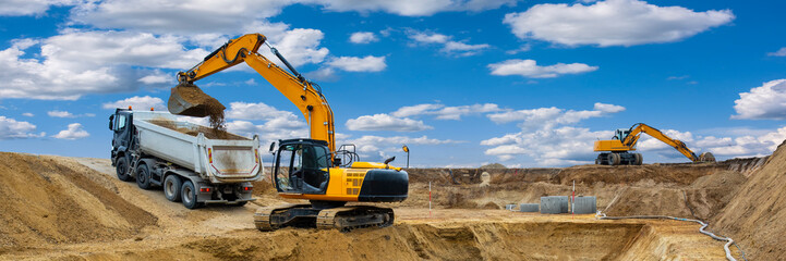 excavator is digging at construction site