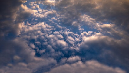Naklejka na ściany i meble blue sky with textured clouds
