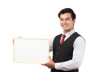 Portrait of happy smiling young businessman showing blank signboard with copyspace for text isolated on white background.