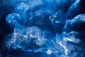 Liquid fluid art abstract background. Blue acrylic paint underwater, galactic smoke ocean