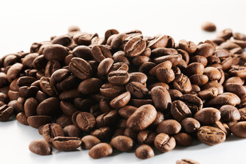 Roasted coffee beans isolated close up on white background, clipping path