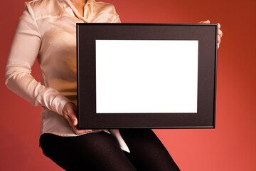 Mock up poster. Minimal template with empty picture frame mock up. Girl holding frame