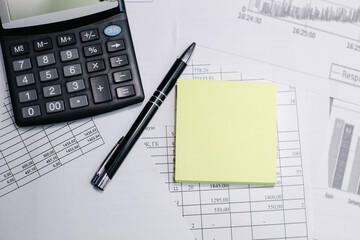 Calculator, pen, graph, white background