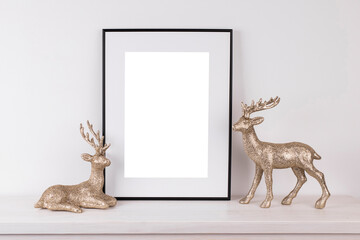 Mock up poster. Minimal template with empty picture frame mock up. Minimalist Christmas interior decoration, reindeer
