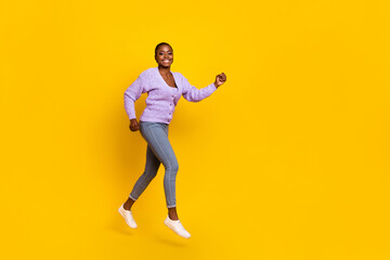 Fototapeta na wymiar Full size profile photo of overjoyed energetic person running empty space isolated on yellow color background