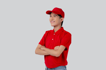 Young asian man in uniform red and cap standing arms crossed with confident isolated on white background, employee or dealer, courier and delivery, deliveryman and expression, logistic and cargo.
