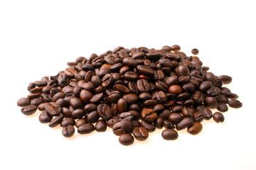 heap of coffee beans on a white background.  soft focus.shallow focus effect.