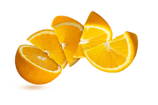 Flying Sliced orange fruits arranged in curved shaped on white backdrop