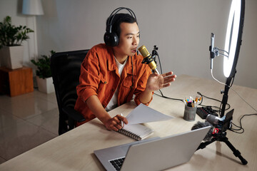 Blogger following scenario when recording podcast for his channel on social media