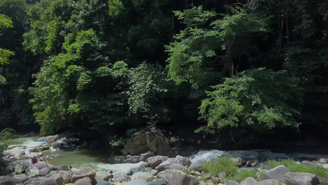 Kenyir, Malaysia - July 23, 2020 Rotating aerial view of Lasir waterfall or Air Terjun Lasir, a tourist attraction in Terengganu.