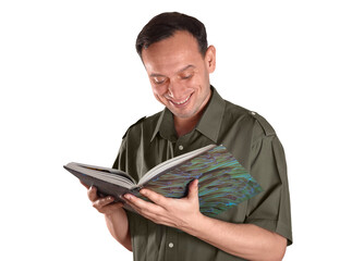 Confident man in green shirt reading a book and smiling