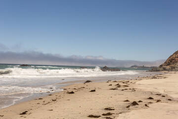 A view on Pacific ocean, cast, rocks and waves