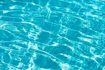 Tansparent clear calm water surface texture. Abstract nature background. Sea water pattern.