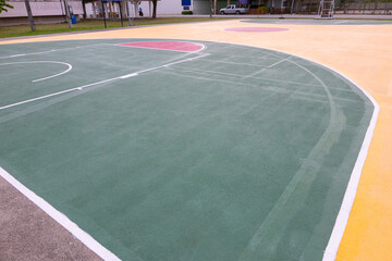 low-angle view of street basketball court with beautiful coloring floor and line shows concept of competition and winning in game for work and business. It is nobody background for sport.