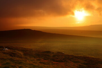 Fototapeta na wymiar Dramatic Lighting over the Pennine Hills at Sunset, North Yorkshire, UK England.