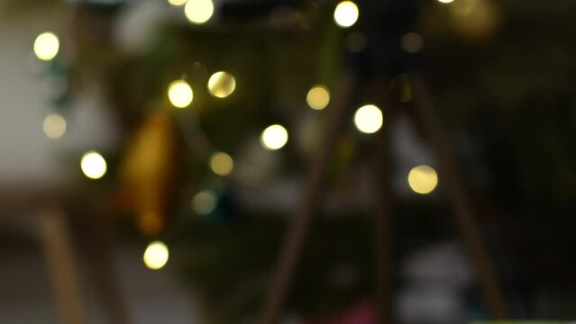 Fairy light on a Christmas tree festive blurred bokeh abstract background
