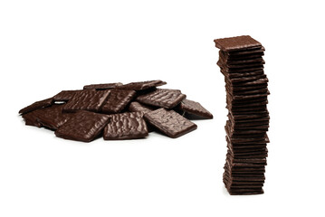 Dark chocolate candies isolated on white background.