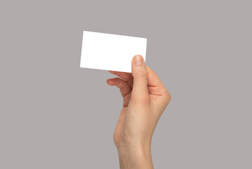 Empty card in woman hand. Copy space.