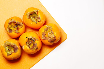 top view of persimmon on white background 