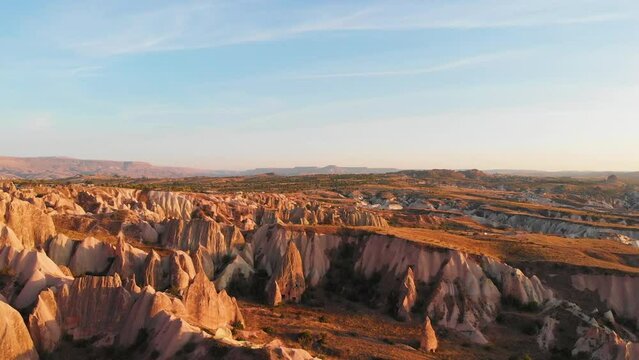 Cappadocia aerial drone view to sunset Red and Rose valley rocks, Goreme Turkey