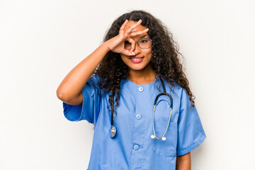 Young hispanic nurse woman isolated on white background excited keeping ok gesture on eye.