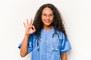 Young hispanic nurse woman isolated on white background cheerful and confident showing ok gesture.