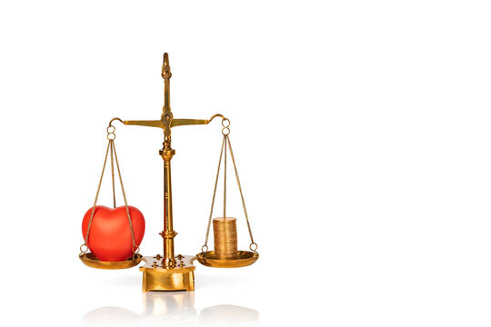 Red Heart And Coins On Weighing Scales Isolated On White Background. The Balance Between Love And Money. Concept Of Family Or Career Choice.