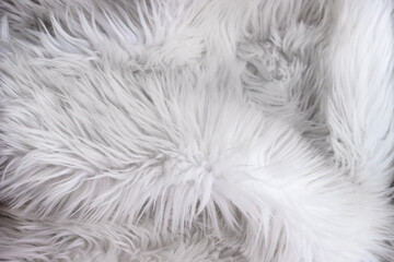 Closeup of white faux fur texture. Background.