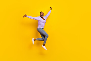 Fototapeta na wymiar Full body photo of overjoyed energetic girl jumping scream rejoice isolated on yellow color background