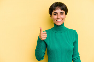 Young caucasian woman with a short hair cut isolated smiling and raising thumb up