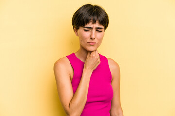 Young caucasian woman with a short hair cut isolated suffers pain in throat due a virus or...