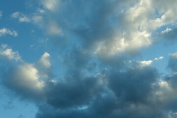 Dark blue evening sky with clouds. Blue hour. Heavenly natural background to overlay on your photos.
