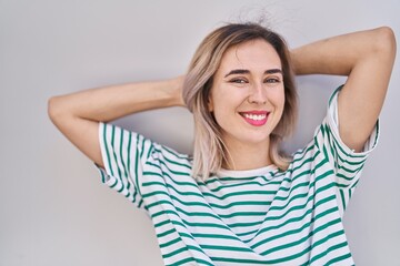 Young woman smiling confident standing over white isolated background